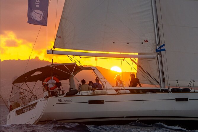 Barcelona Coastal Sailing (Open Bar, Catalan Snack & Swim Stop) - Stop 4: Tibidabo at sunset with warm colors