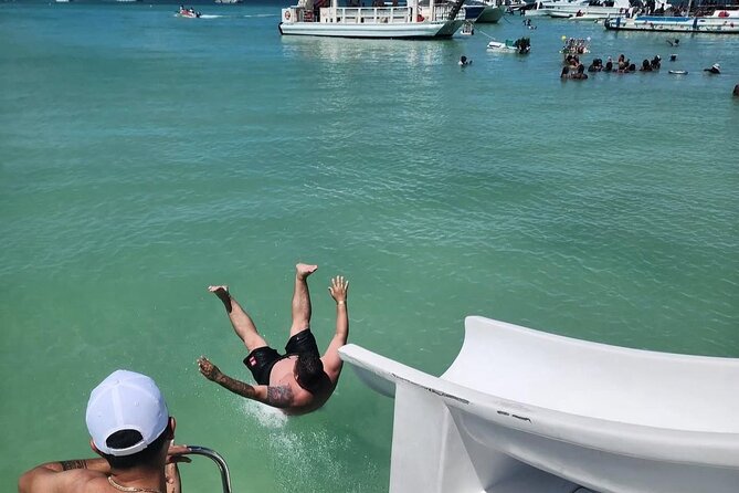 Catamaran party in Punta Cana with open bar, music and more - Stop 1 in Bávaro: a short dolphin-spotting moment from the boat