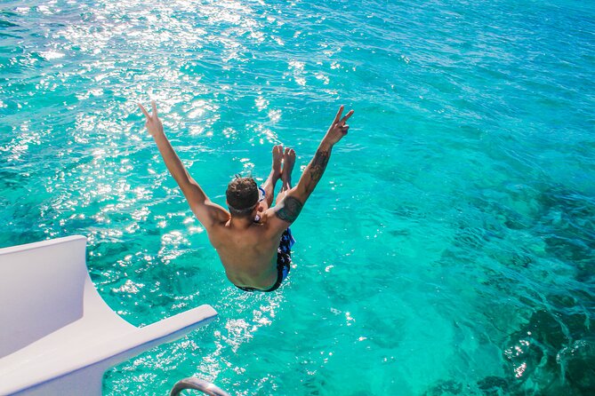 Float & Feast Private Party Cruise with Premium Buffet & Open Bar - The boat setup: double-deck catamaran, slide, and onboard show