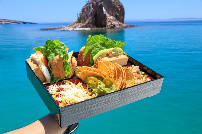 Half Day Cabo Snorkel Adventure with Lunch and Open Bar - Two snorkel windows, plus sea scooters for real speed
