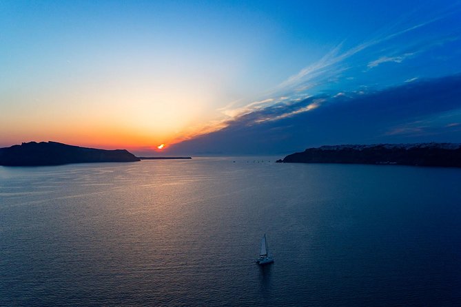 Luxury Sunset Cruise with Swim Stops, BBQ meals and Open Bar - Following the Caldera: Volcano Sails, Hot Springs, and Swim Stops