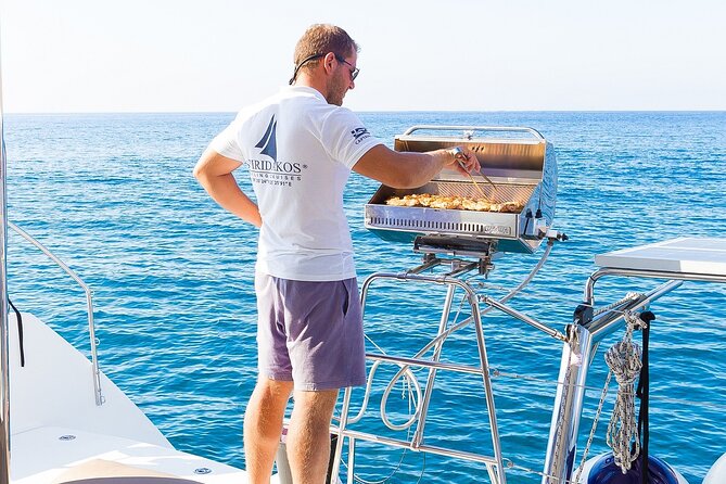 Premium Small-Group Catamaran Cruise with BBQ, Open Bar, Transfer - The quiet Santorini cove for snorkeling and BBQ: where the day clicks