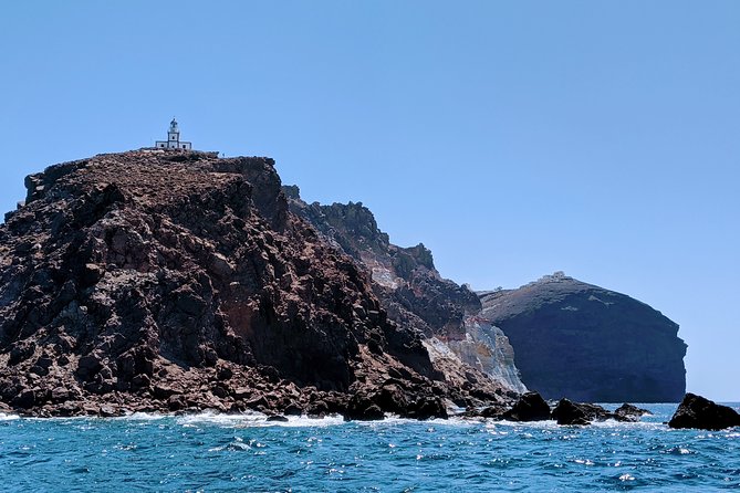 Private Full-Day Motor Yacht Cruise with Meal, Open Bar+Transfers - Volcano and hot springs: the center of gravity for Santorini’s geology