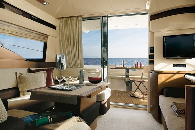 Private Motor Yacht Cruise with BBQ, Open Bar & Transfers - Sailing Past Caves, Rock Formations, and the Southern Caldera