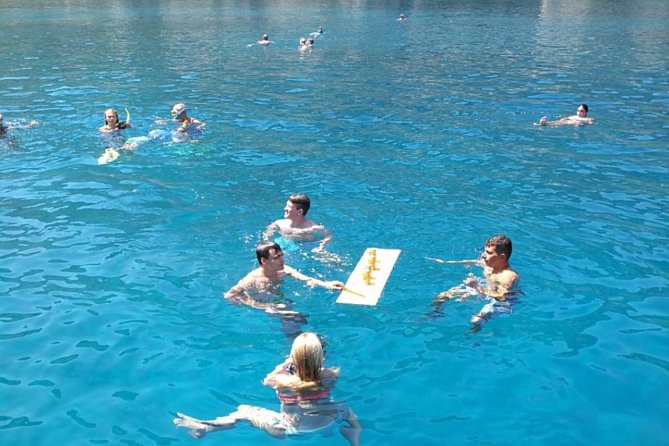 Rhodes Exclusive Swim Cruise Cocktail Open bar & Gourmet Buffet - Ladikos Bay behind Anthony Quinn: caves and the oil-ship story