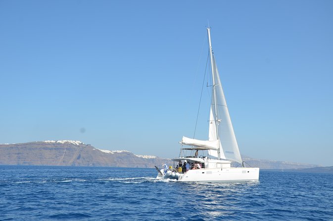 Santorini Caldera Gold Day Cruise with BBQ on board and Open Bar - Red Beach: The Color Stop You Can Swim From