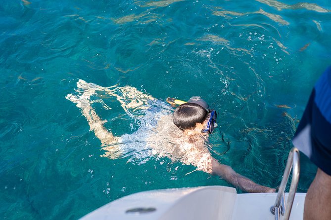 Santorini Caldera Gold Day Cruise with BBQ on board and Open Bar - Akrotiri Lighthouse: The Pass-By View That Makes Photos Worth It