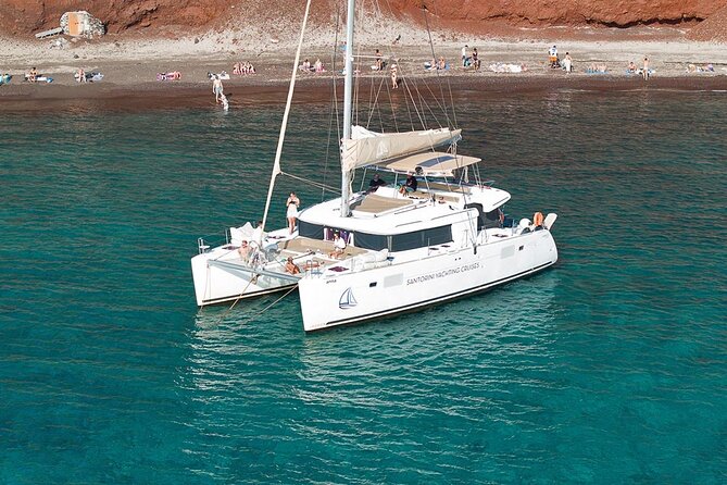 Santorini Catamaran Cruise: with Lunch, BBQ, Open Bar, Transfers - Red Beach Stop: Color, Swimming Time, and a Ticket Included