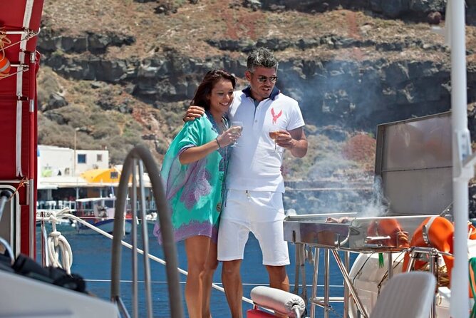 Santorini Cruise on Catamaran with BBQ & Open Bar - Stop 1: Santorini Volcano Hot Springs Swim and Black-Rock Views