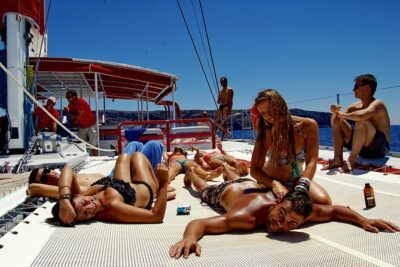 Santorini Cruise on Catamaran with BBQ & Open Bar - Getting to the Boat: Hotel Pickup, Ports, and the 50 m Safety Distance