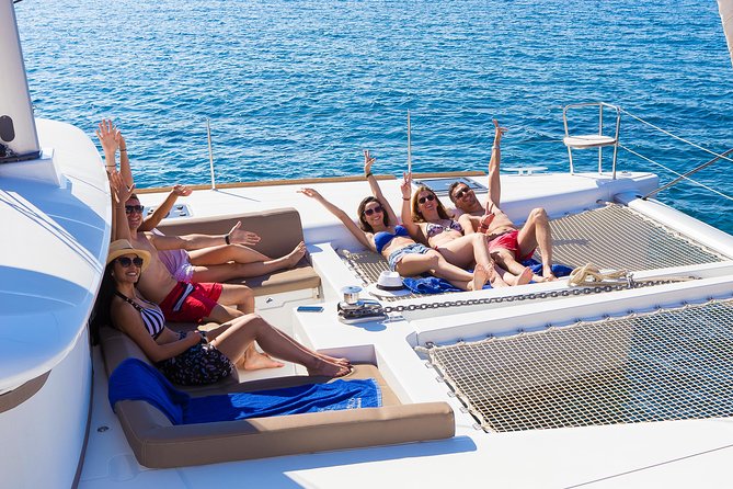 Santorini Private Catamaran Cruise with BBQ, Open Bar & Transfers - Red Beach at Akrotiri: the quick photo stop with a reason behind the color