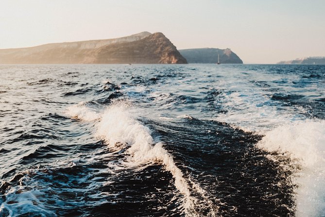 Santorini Private Catamaran Cruise with BBQ, Open Bar & Transfers - White Beach: boat-only swimming and snorkeling in clear water