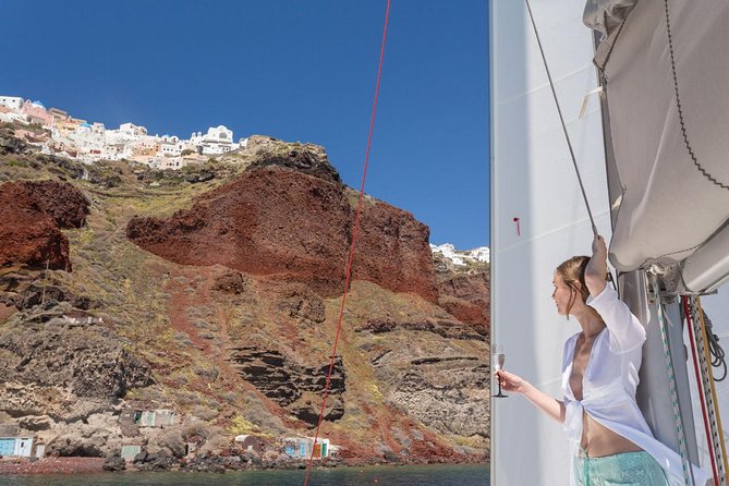 Santorini Private Catamaran Cruise with BBQ, Open Bar & Transfers - Indian Rocks and caves: geology you can see from sea level