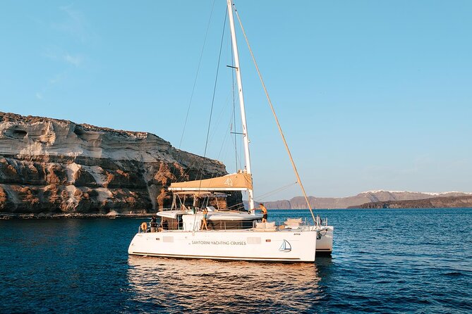 Santorini Sunset Sailing Cruise: Dinner, BBQ, Open Bar, Transfers - Sailing highlights: White Beach, Indian Rocks, and a Venetian Lighthouse view