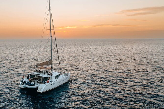 Santorini Sunset Sailing Cruise: Dinner, BBQ, Open Bar, Transfers - Stop 3: Mesa Pigadia Beach for swimming and snorkelling, plus Greek dinner